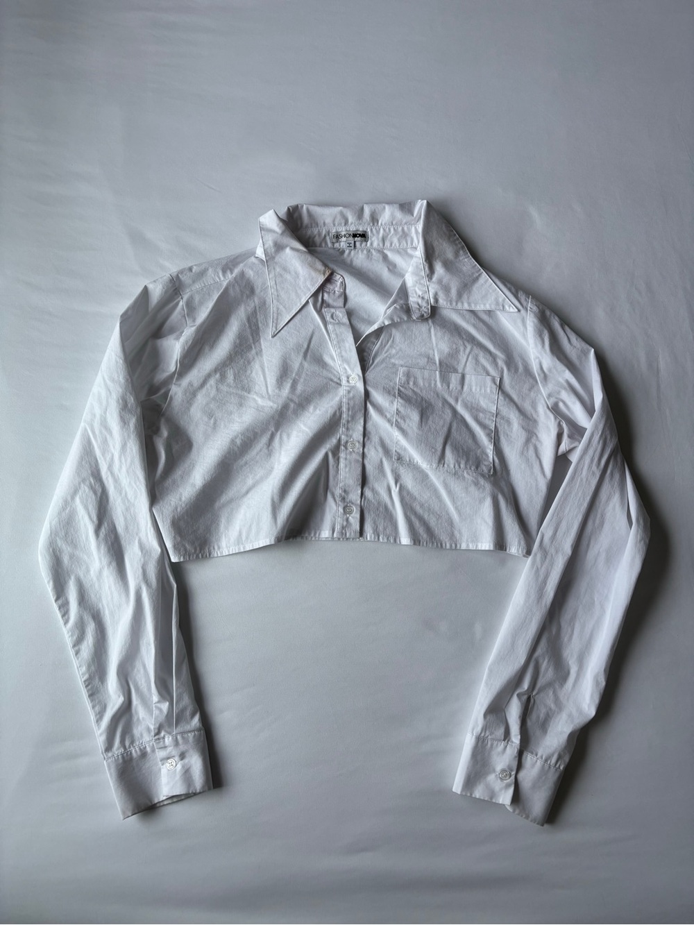 Fashion Nova white cropped button up top